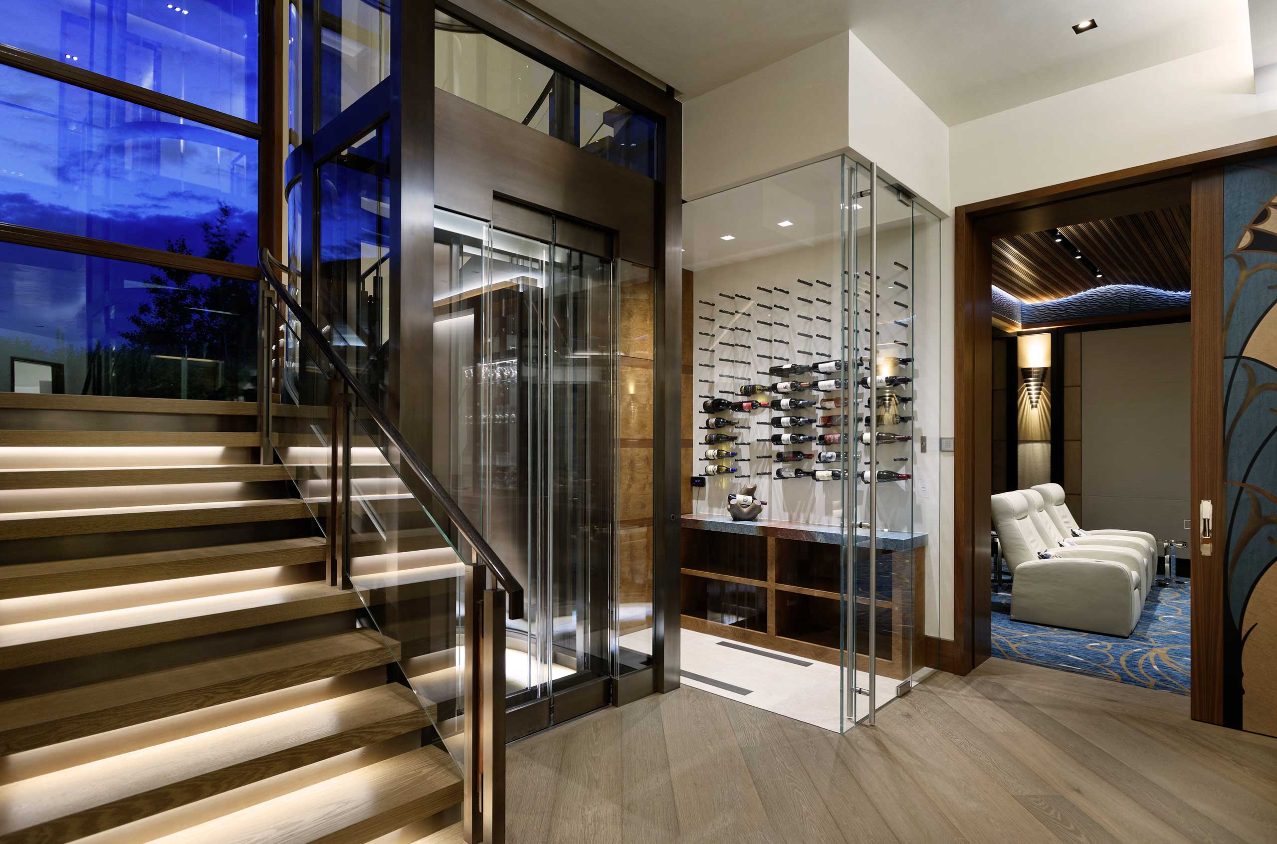 Spacious entryway of an Aspen Cuvée luxury villa with oversized glass windows, sweeping mountain views and custom luxury interior design.