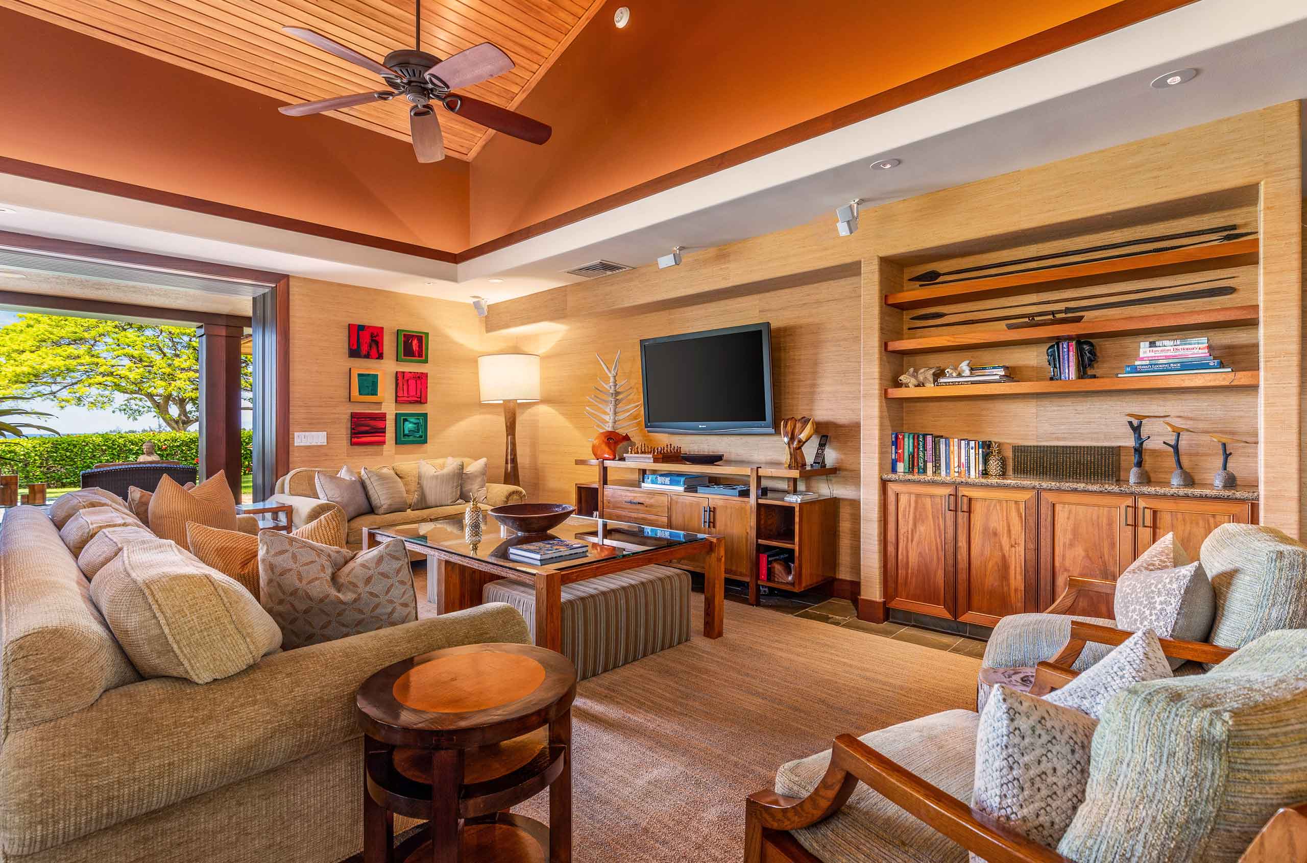 Spacious living room of a Big Island Cuvée luxury villa with Koa wood, sweeping ocean views and fresh air flowing through an open floor plan.